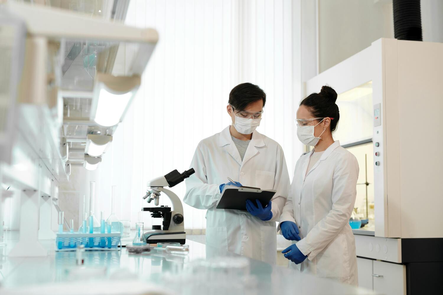 Scientists in an FDA-registered laboratory studying the HerpaFend formula